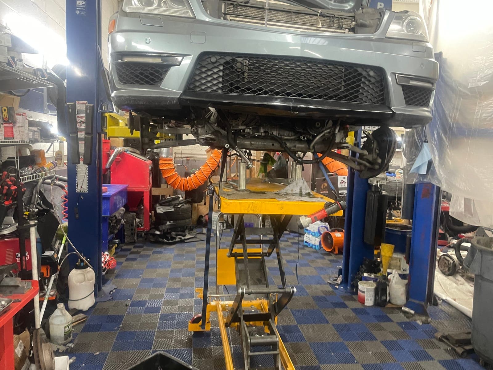 Vehicle on lift for undercarriage service